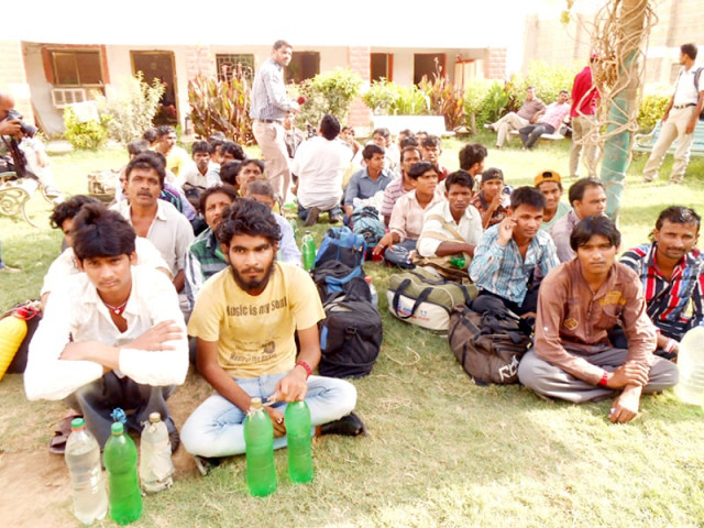 a file photo of fishermen from india sit while waiting after their release from a prison in karachi photo pff file