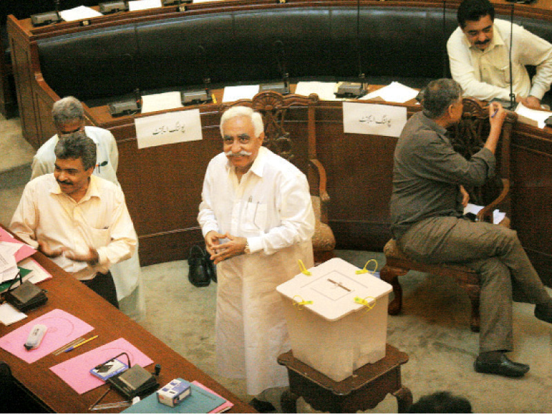 pml n parliamentary leader irfanullah marwat smiles as he glances towards the media gallery during the presidential elections on tuesday photo athar khan express