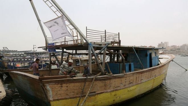 a picture taken on june 9 2013 shows palestinian fishermen who are working with foreign activists to transform a large fishing boat into quot gaza 039 s ark quot with the aim of exporting local produce in the latest bid to break israel 039 s blockade on the gaza strip photo afp