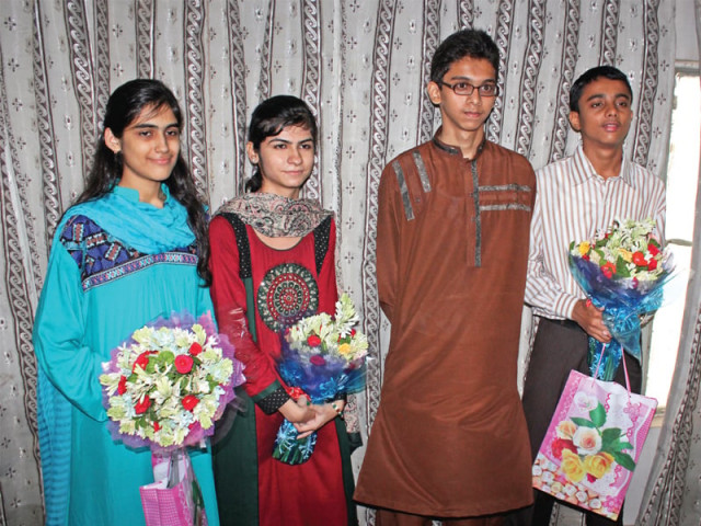 third position holders daniya ali and karishma kumari on the left second position holder syed muhammad usman ali centre right and first position holder ammar sarmad khan right after receiving results of the bsek on thursday photo express third position holders daniya ali and karishma kumari on the left second position holder syed muhammad usman ali centre right and first position holder ammar sarmad khan right after receiving results of the bsek on thursday photo express