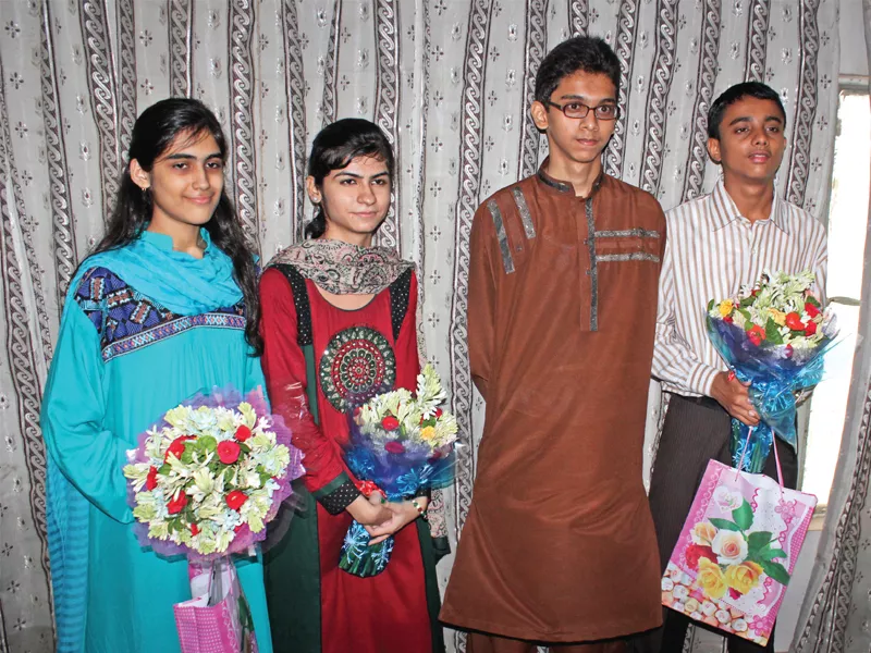 third position holders daniya ali and karishma kumari on the left second position holder syed muhammad usman ali centre right and first position holder ammar sarmad khan right after receiving results of the bsek on thursday photo express third position holders daniya ali and karishma kumari on the left second position holder syed muhammad usman ali centre right and first position holder ammar sarmad khan right after receiving results of the bsek on thursday photo express