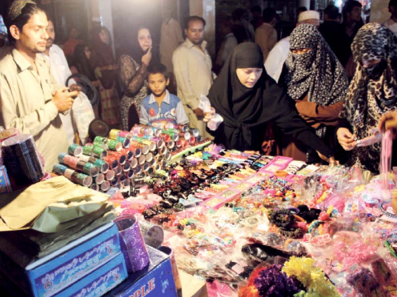 though markets have been flooded with eid customers shopkeepers complain that customers are indulging in more window shopping this time around photo express waqas naeem