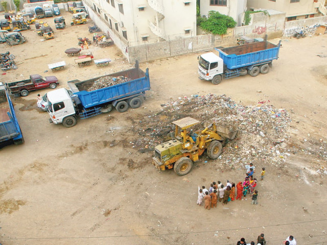 a youth initiative go green approached karachi commissioner and helped initiate a clean up of shah rasul colony in dha the huge piles of garbage were picked up on friday afternoon photo athar khan express a youth initiative go green approached karachi commissioner and helped initiate a clean up of shah rasul colony in dha the huge piles of garbage were picked up on friday afternoon photo athar khan express