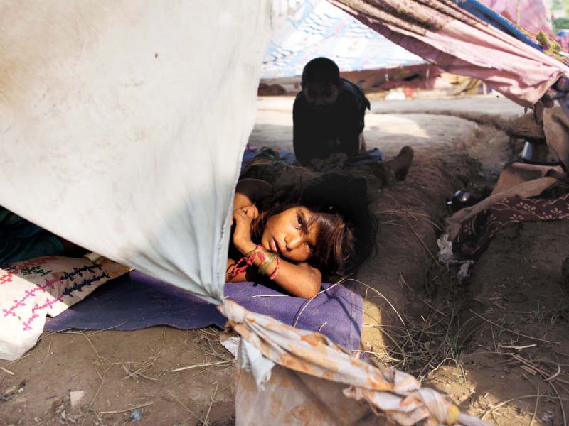 a nomad girl stares as she rests in a tent photo myra iqbal express