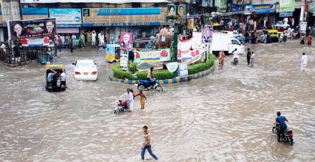 vehicles and people try to navigate through a flooded square in hyderabad on saturday photo shahid ali express vehicles and people try to navigate through a flooded square in hyderabad on saturday photo shahid ali express