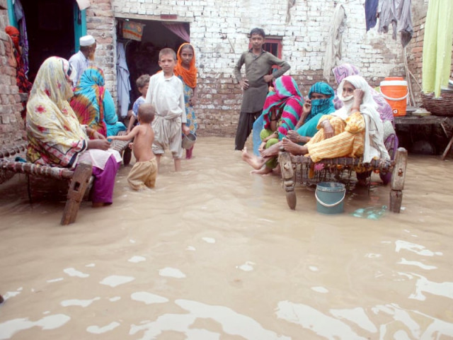 residents of micro colony in sukkur sit on charpoys after rainwater entered their homes on saturday photo express naeem ahmed ghouri residents of micro colony in sukkur sit on charpoys after rainwater entered their homes on saturday photo express naeem ahmed ghouri