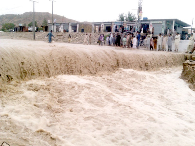 a massive torrent sweeps through a road in kalat photo express file a massive torrent sweeps through a road in kalat photo express file