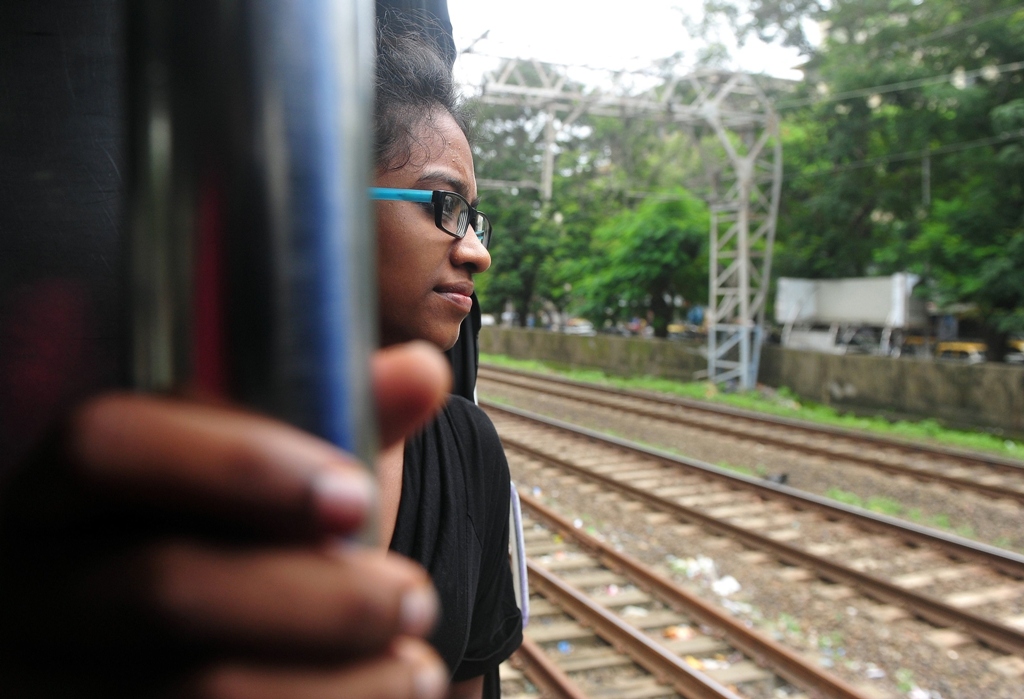 this photo taken on july 27 2013 shows indian woman shweta katti travelling on a suburban train to a fundraiser in mumbai to support her education at new york 039 s bard college photo afp