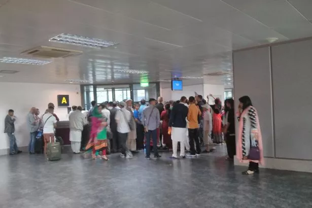 passengers waiting for the plane photo manchestereveningnews co uk passengers waiting for the plane photo manchestereveningnews co uk