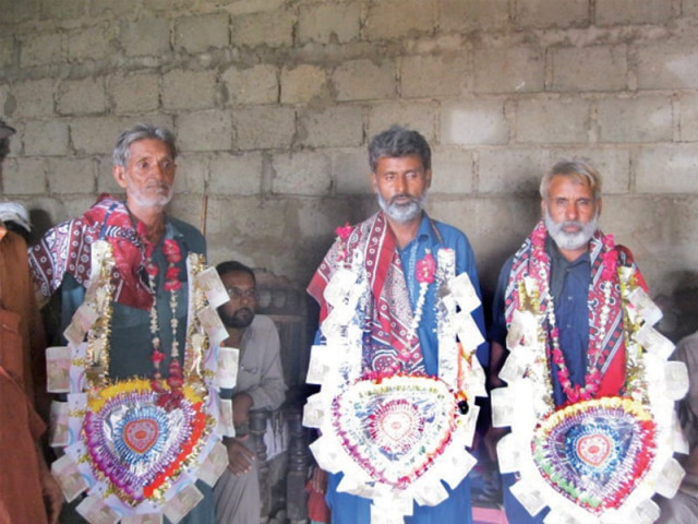the three released fishermen being warmly welcomed on their return home photo express