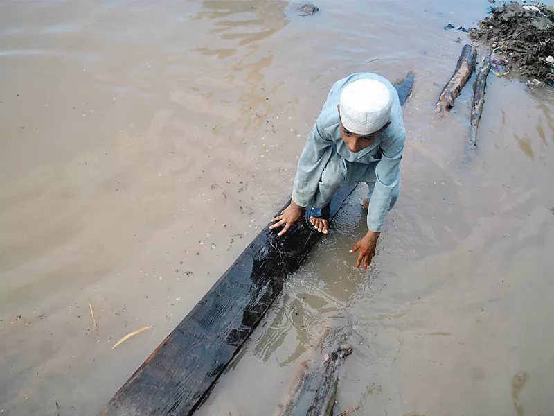 a child tries to get to a safer place as floods disrupt life in charsadda photo muhammad iqbal express a child tries to get to a safer place as floods disrupt life in charsadda photo muhammad iqbal express
