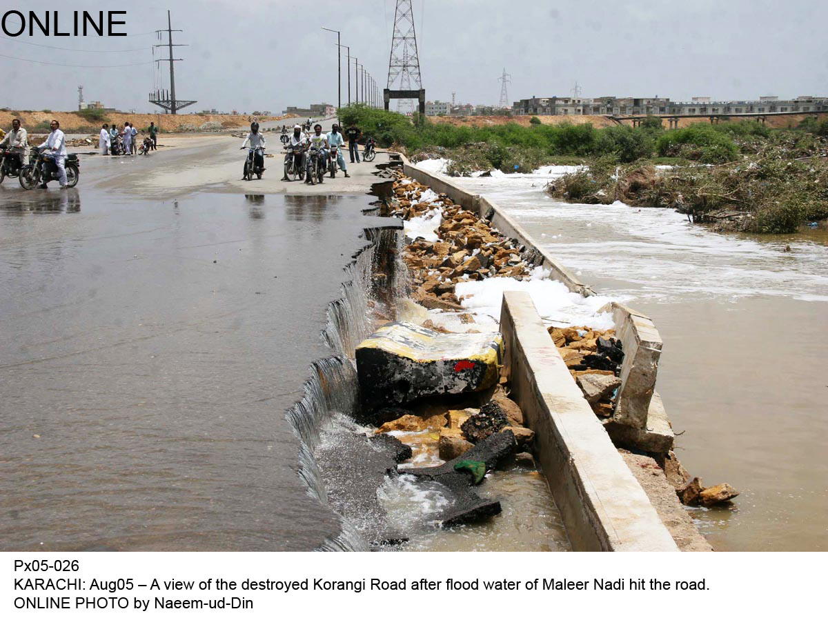 a section of the korangi road washed away under the rising waters of the malir river photo online