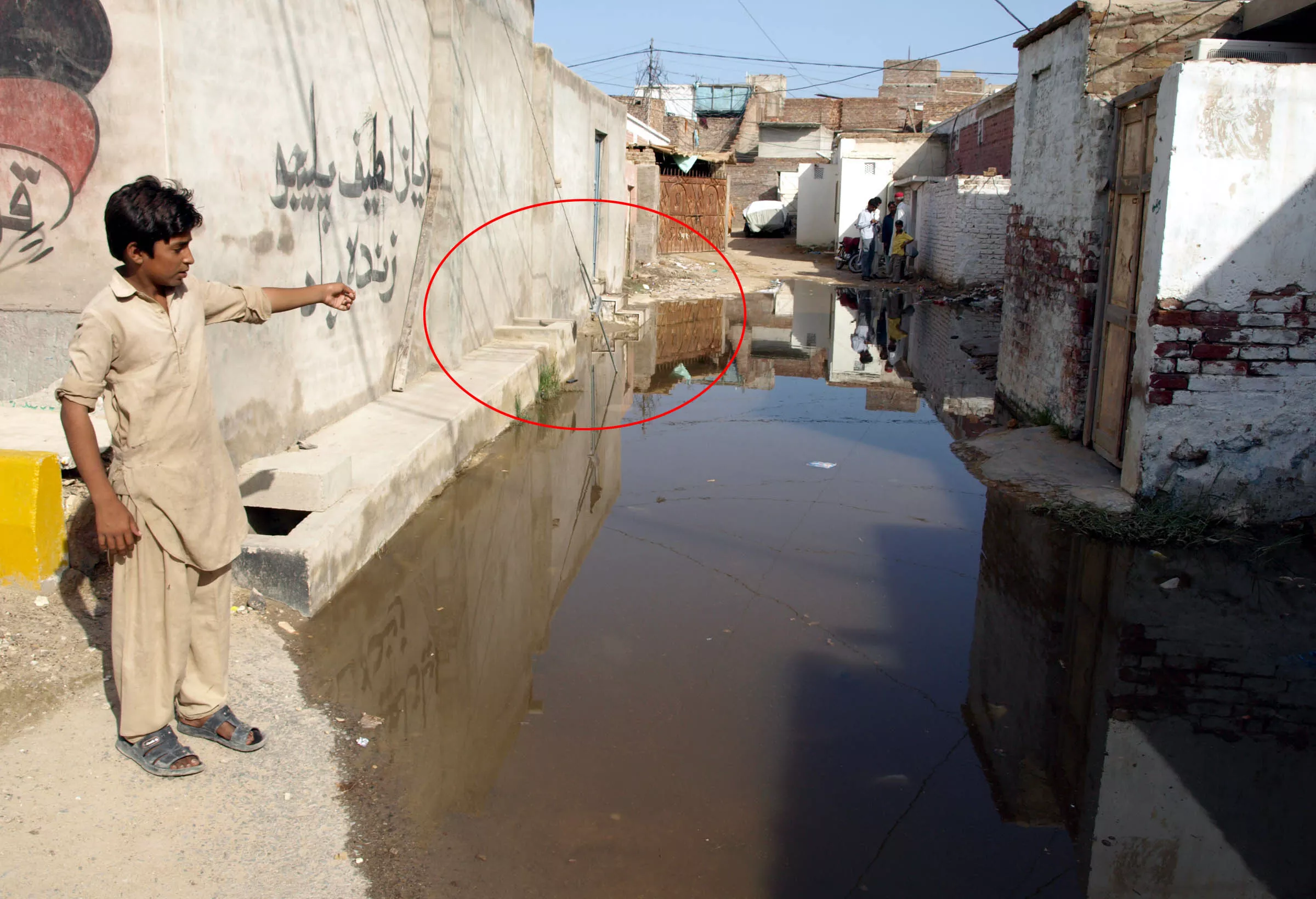 a boy points to the spot where the four children were electrocuted photo adeel ahmed express a boy points to the spot where the four children were electrocuted photo adeel ahmed express