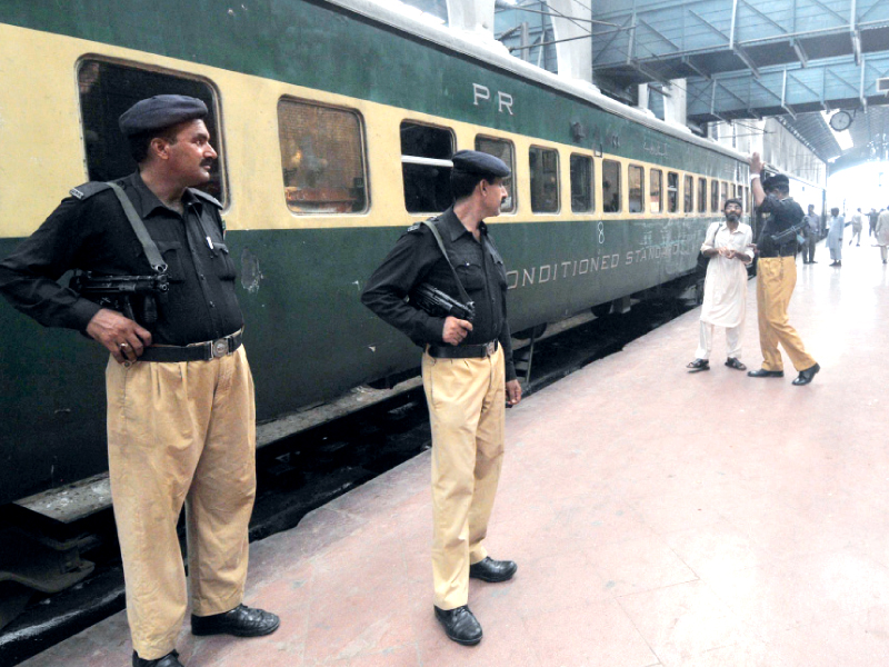 policemen stand guard at the lahore railway station after a bomb exploded in shalimar express photo afp