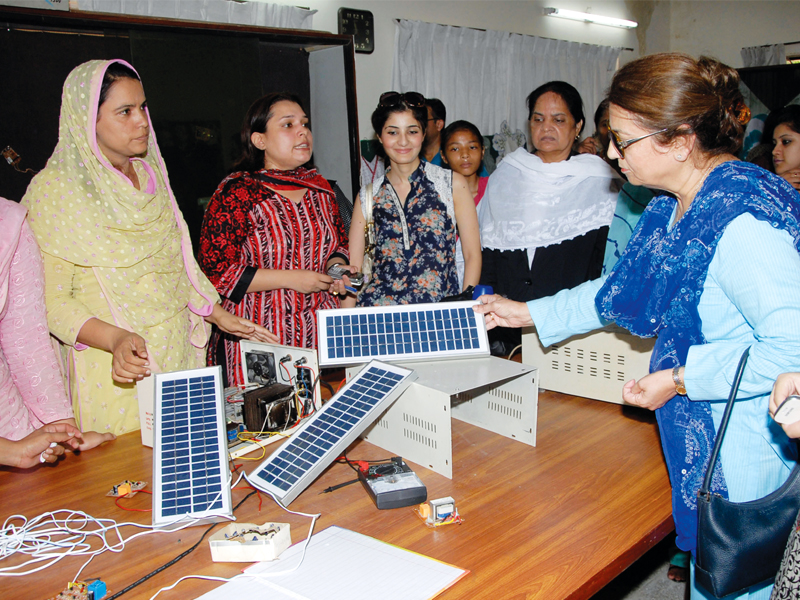 the exhibition displayed solar panels ups silk paintings clay paintings post cards embroidery and clay utensils photo shafiq malik express