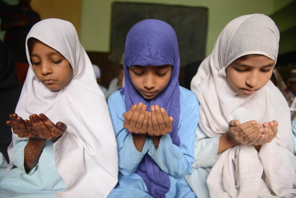 indian muslim students offer 039 dua 039 prayers in their class room during the holy month of ramadan at madrasatur rashaad religious school in hyderabad on july 17 2013 photo afp