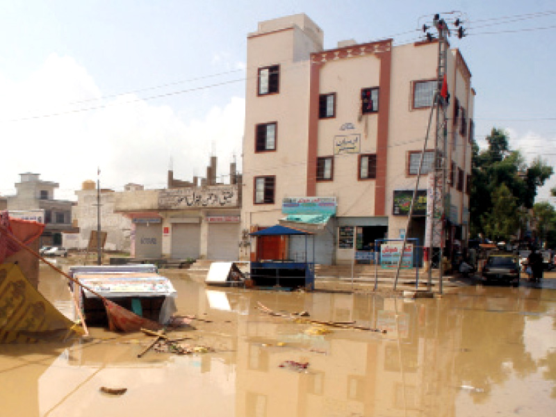 saadi town is still submerged in water after saturday s rainfall no clean drinking water is available for residents after floodwater seeped into the pipelines and underground tanks photo athar khan express