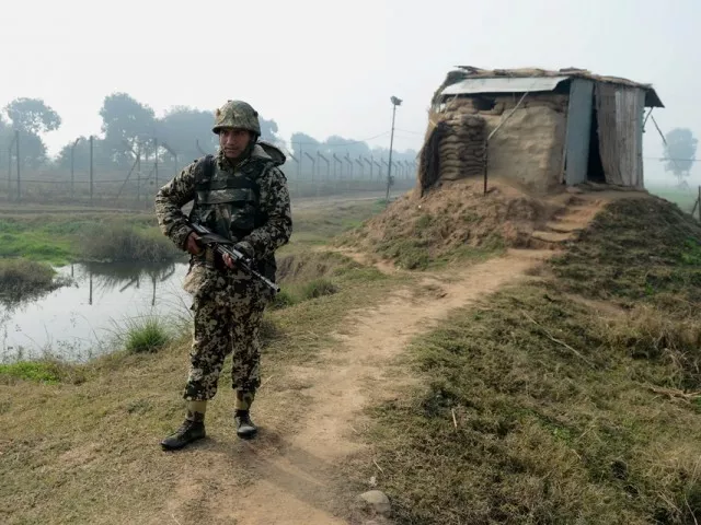 an indian border security force bsf soldier keeps watch at an outpost along the india pakistan border photo afp an indian border security force bsf soldier keeps watch at an outpost along the india pakistan border photo afp