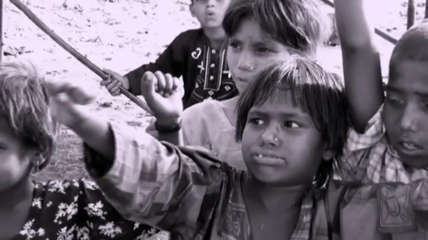 children in a slum near the river ravi lahore