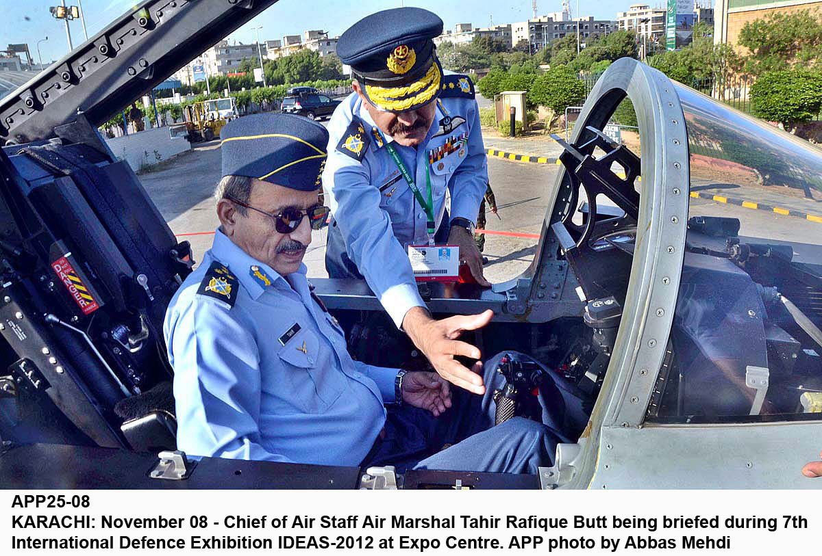 chief of air staff air marshal tahir rafiq butt sits inside the cockpit of a fighter aircraft and is briefed on the systems during ideas 2012 photo app file