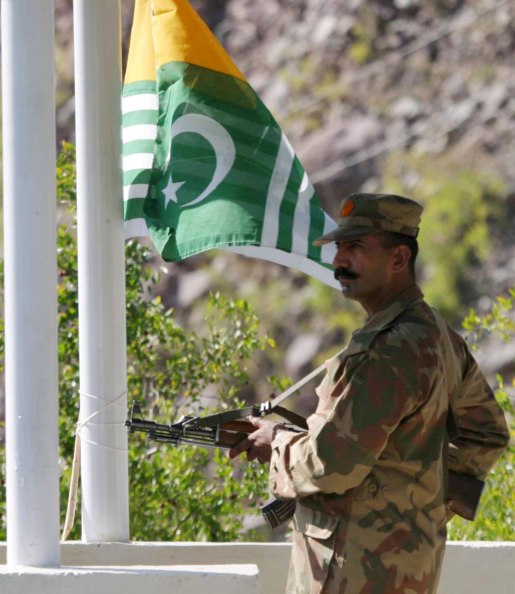a pakistani soldier stands guard at the line of control photo file