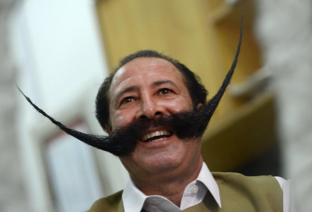 in this photograph taken on july 24 2013 pakistani businessman malik amir mohammad khan afridi smiles during an interview with afp in peshawar photo afp in this photograph taken on july 24 2013 pakistani businessman malik amir mohammad khan afridi smiles during an interview with afp in peshawar photo afp