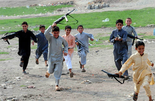 a large number of children many under the age of 10 can be seen carrying toy guns of all shapes and sizes photo afp file