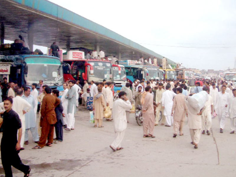 the twin cities residents thronged bus stations on the eve of eidul fitr which they will celebrate with relatives back in their home towns photo inp