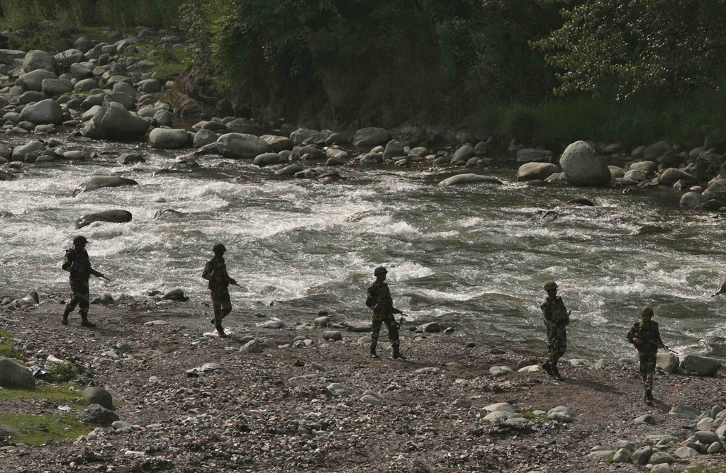 indian border security force bsf soldiers patrol next to a stream near the line of control loc a ceasefire line dividing kashmir between india and pakistan at sabjiyan sector of poonch district august 8 2013 photo reuters