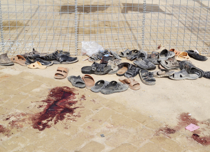 footwear is seen near a pool of blood at the site of gun battle in quetta august 9 2013 photo reuters