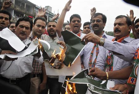 members of the youth wing of bjp shout slogans and burn pakistan 039 s national flags during a protest in chandigarh photo reuters file