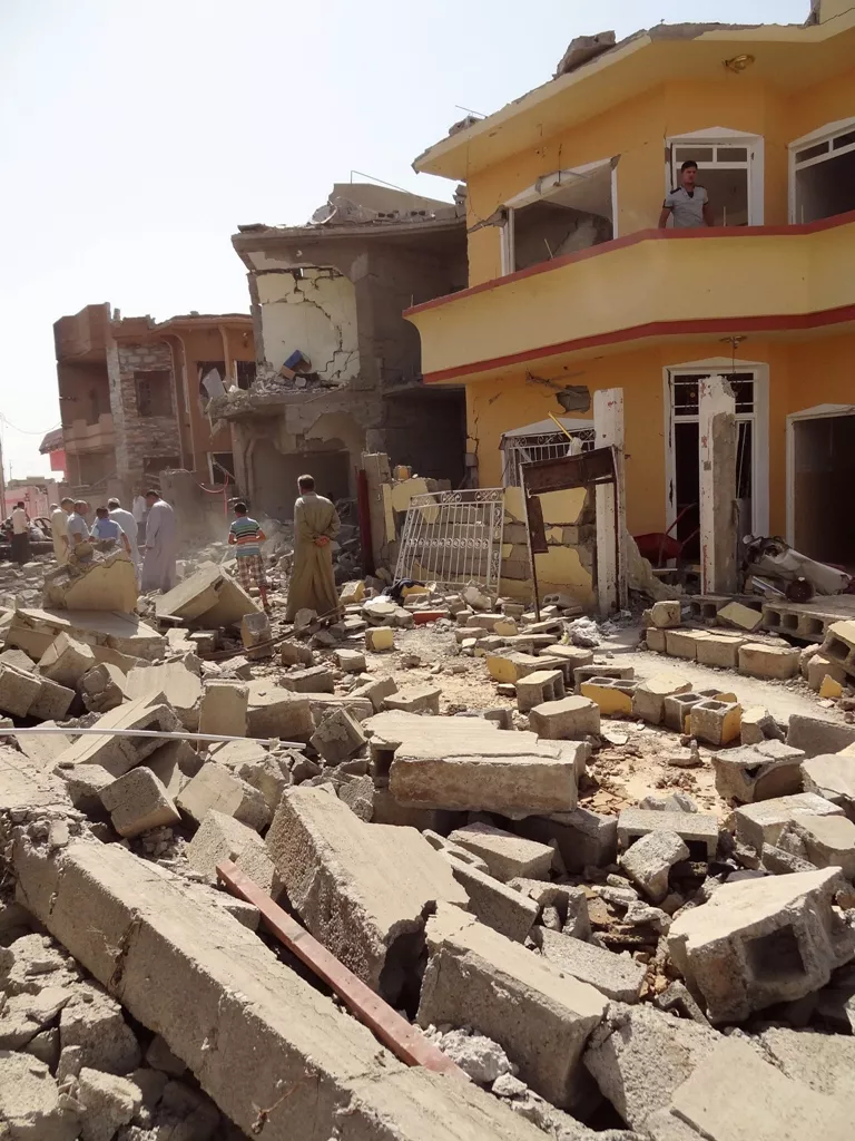 iraqis inspect the remains of houses after a suicide bomber detonated the day before an explosives rigged vehicle on august 11 2013 in the northern city of tuz khurmatu photo afp marwan ibrahim iraqis inspect the remains of houses after a suicide bomber detonated the day before an explosives rigged vehicle on august 11 2013 in the northern city of tuz khurmatu photo afp marwan ibrahim