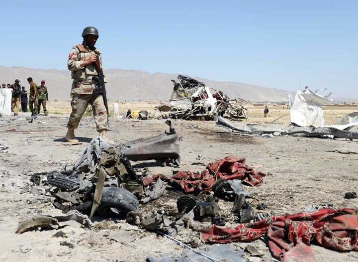 pakistani security officials are pictured at the site of a bomb attack on a vehicle used by security forces on the outskirts of quetta photo afp file