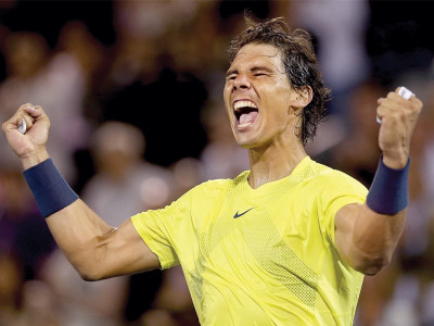 nadal sets up raonic title clash