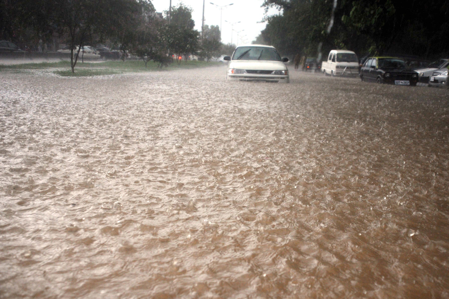 rain water collects on a busy road as heavy monsoon rains flood areas of punjab photo qazi usman file