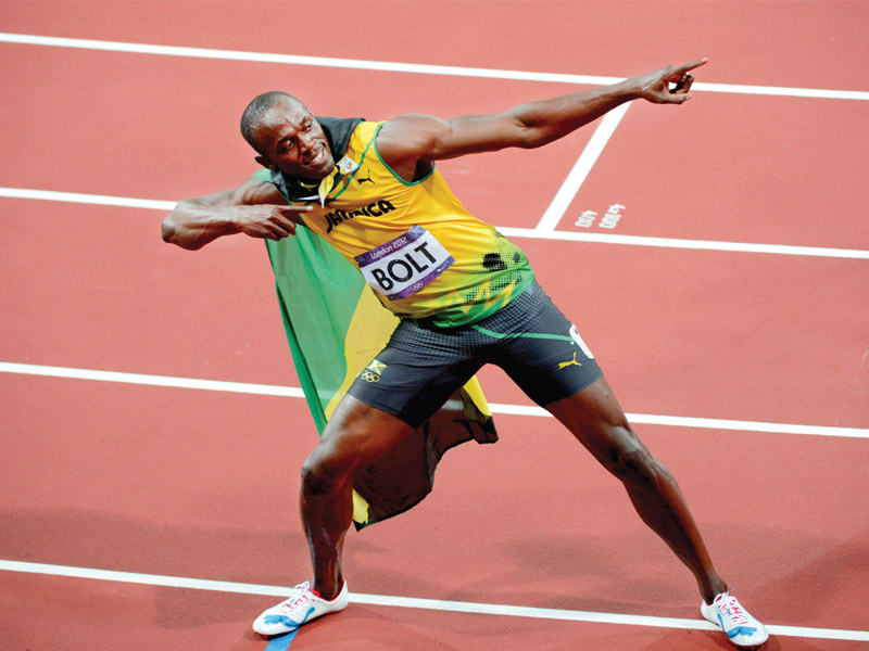 bolt clocked a season s best 9 77 seconds in heavy rain at the luzhniki stadium photo afp