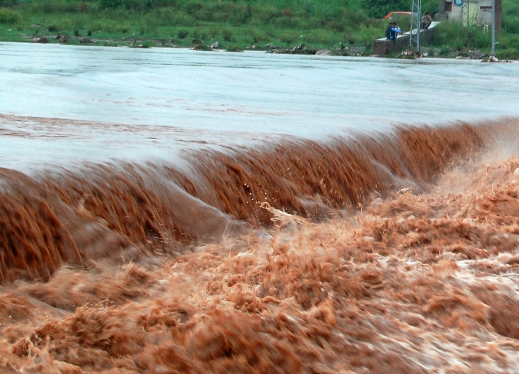 flooded water of nullah korang crossing over a causeway bridge after heavy rain started midnight till saturday morning in twin cities of rawalpindi islamabad photo muhammad javaid