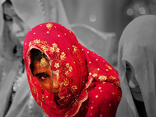 a few notes had exchanged hands and then there she was covered in a red veil presented before her soon to be husband like an offering photo afp