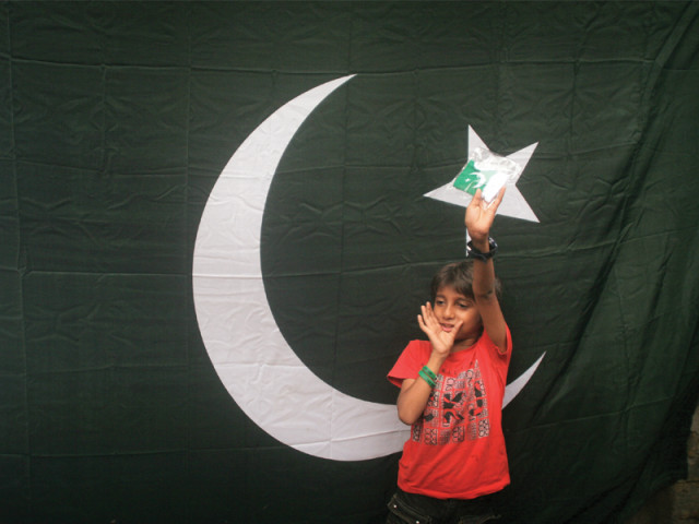a young boy faraz shows off his green and white buntings that he bought from pakistan chowk to decorate his house the pleasant weather and the subsequent rain failed to dampen the spirit of independence in the city photo athar khan express a young boy faraz shows off his green and white buntings that he bought from pakistan chowk to decorate his house the pleasant weather and the subsequent rain failed to dampen the spirit of independence in the city photo athar khan express