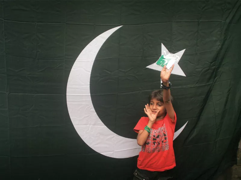 a young boy faraz shows off his green and white buntings that he bought from pakistan chowk to decorate his house the pleasant weather and the subsequent rain failed to dampen the spirit of independence in the city photo athar khan express a young boy faraz shows off his green and white buntings that he bought from pakistan chowk to decorate his house the pleasant weather and the subsequent rain failed to dampen the spirit of independence in the city photo athar khan express
