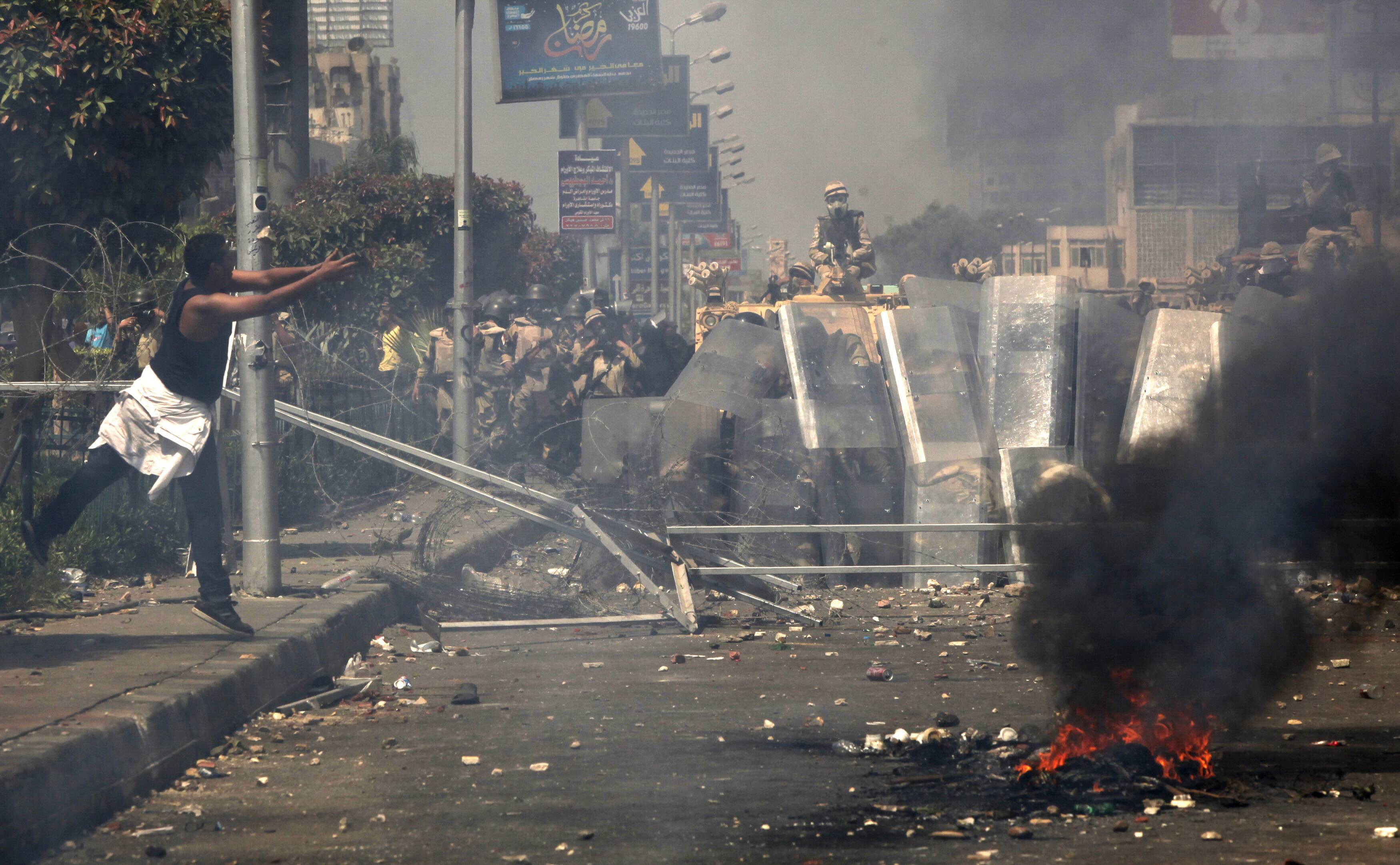 members of the muslim brotherhood and supporters of ousted egyptian president mohamed mursi throw stones at riot police and the army during clashes photo reuters