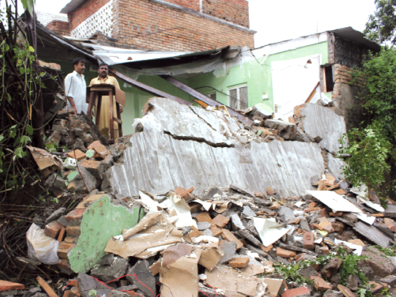 a portion of a house s roof in g 7 3 caved in after the capital was hammered with continuous rain on wednesday photo sehrish wasif express