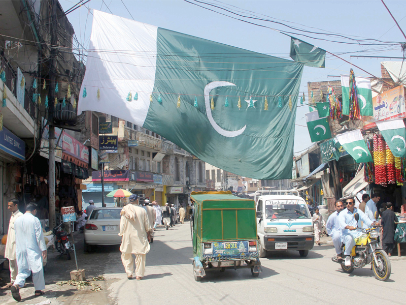 centre a large pakistani flag hung near nishat chowk in mingora on august 14 bottom left a father and his boys dressed in uniform ride a motorcycle on arbab road above the memorial in shahi bagh where muhammad ali jinnah addressed the people of peshawar on october 19 1936 photo express