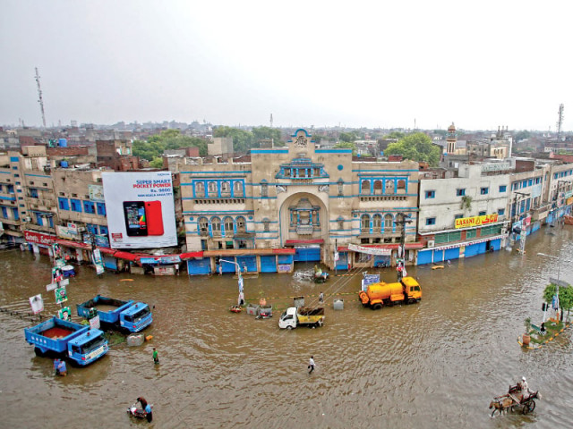 a view of a flooded street in punjab s provincial capital after a fresh spell of monsoon rains on independence day photo reuters a view of a flooded street in punjab s provincial capital after a fresh spell of monsoon rains on independence day photo reuters