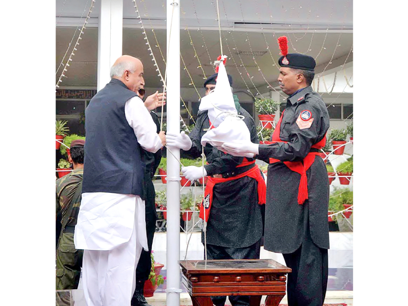 balochistan chief minister dr abdul malik baloch hoisting national flag during a ceremony at the lawn of balochistan assembly to mark the 67th independence day photo app