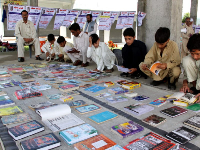 residents of matta vowed to strive to earn a positive name for the area where people would choose books over guns photo express