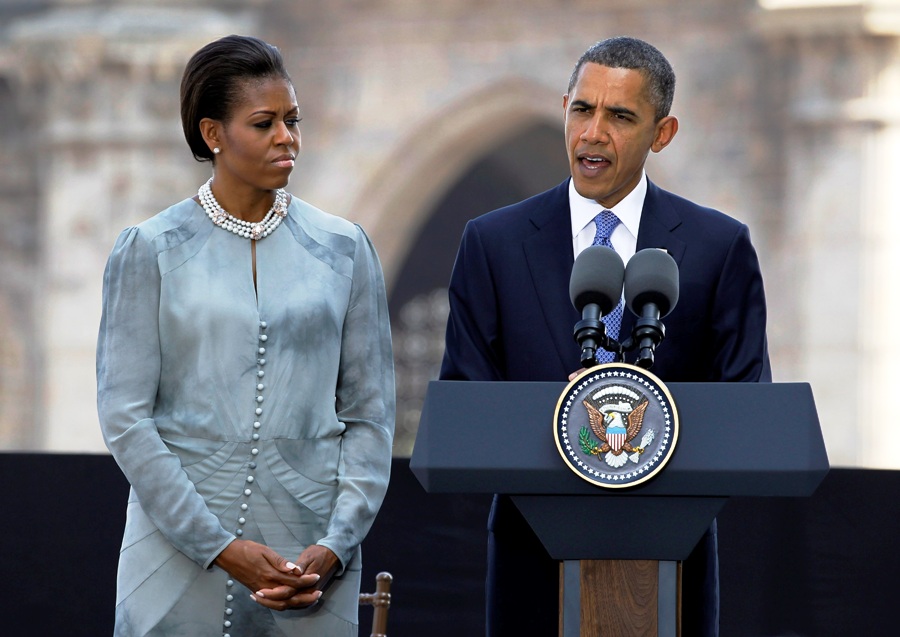 u s president barack obama speaks as first lady michelle obama looks on at the taj mahal palace and tower hotel in mumbai photo reuters file