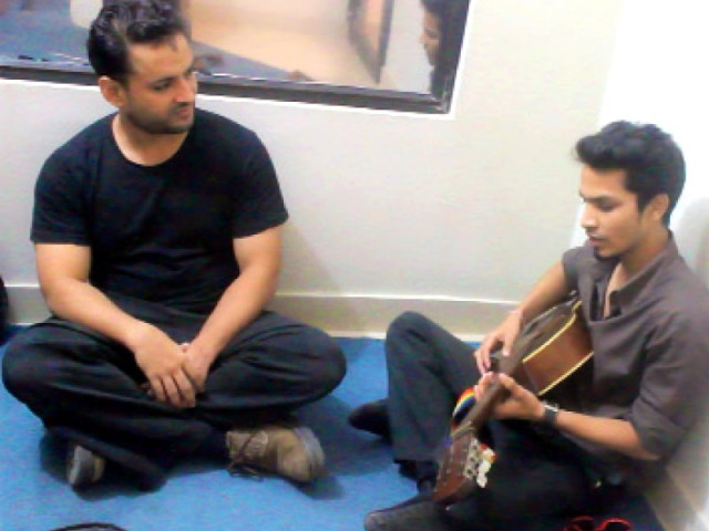 faisal gill left treats patients with disorders through the power of sounds at his studio at ziauddin college for speech and language therapy in karachi photo express