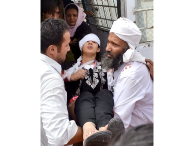 people help an injured victim at a hospital after the attack photo afp people help an injured victim at a hospital after the attack photo afp