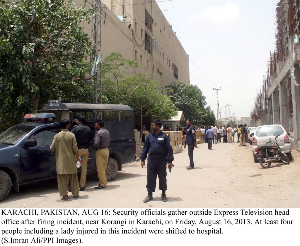 security officials gathered outside express media group office after the firing incident photo ppi